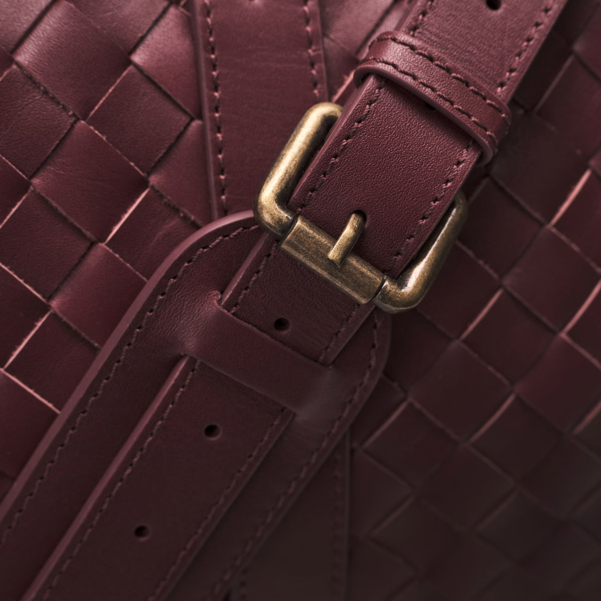 James (50) woven leather weekender in Burgundy Red with leather shoulder strap and woven texture in detail