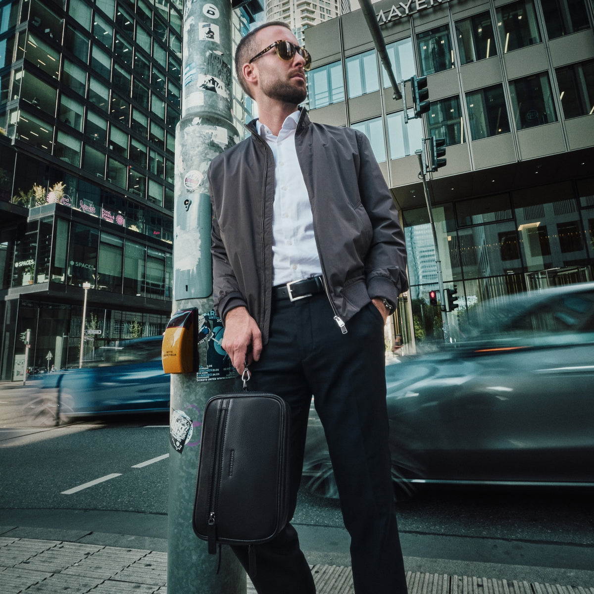 Roberto wristlet in Black worn on the move