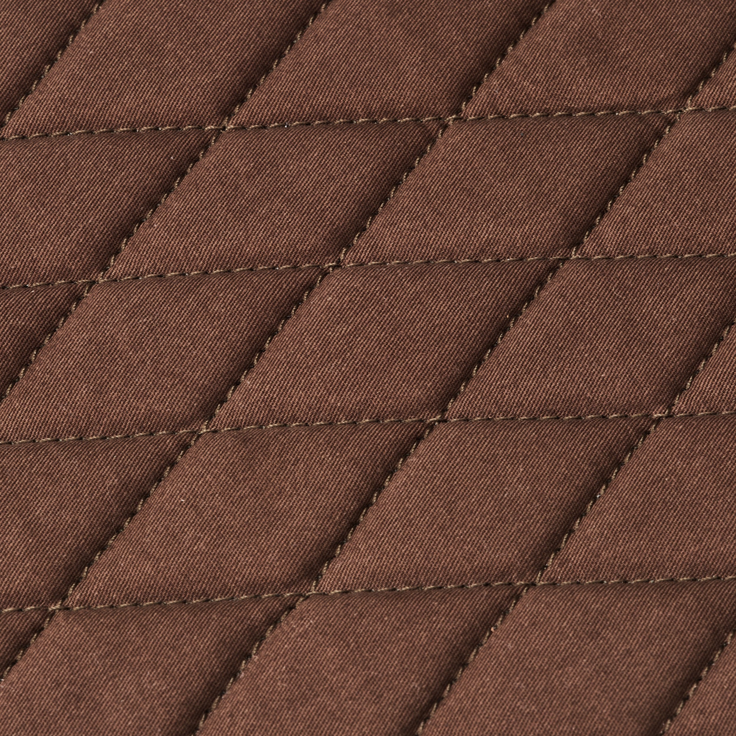 Diamond stitching on the grey-brown interior padding of the Nolan buffalo leather tablet bag