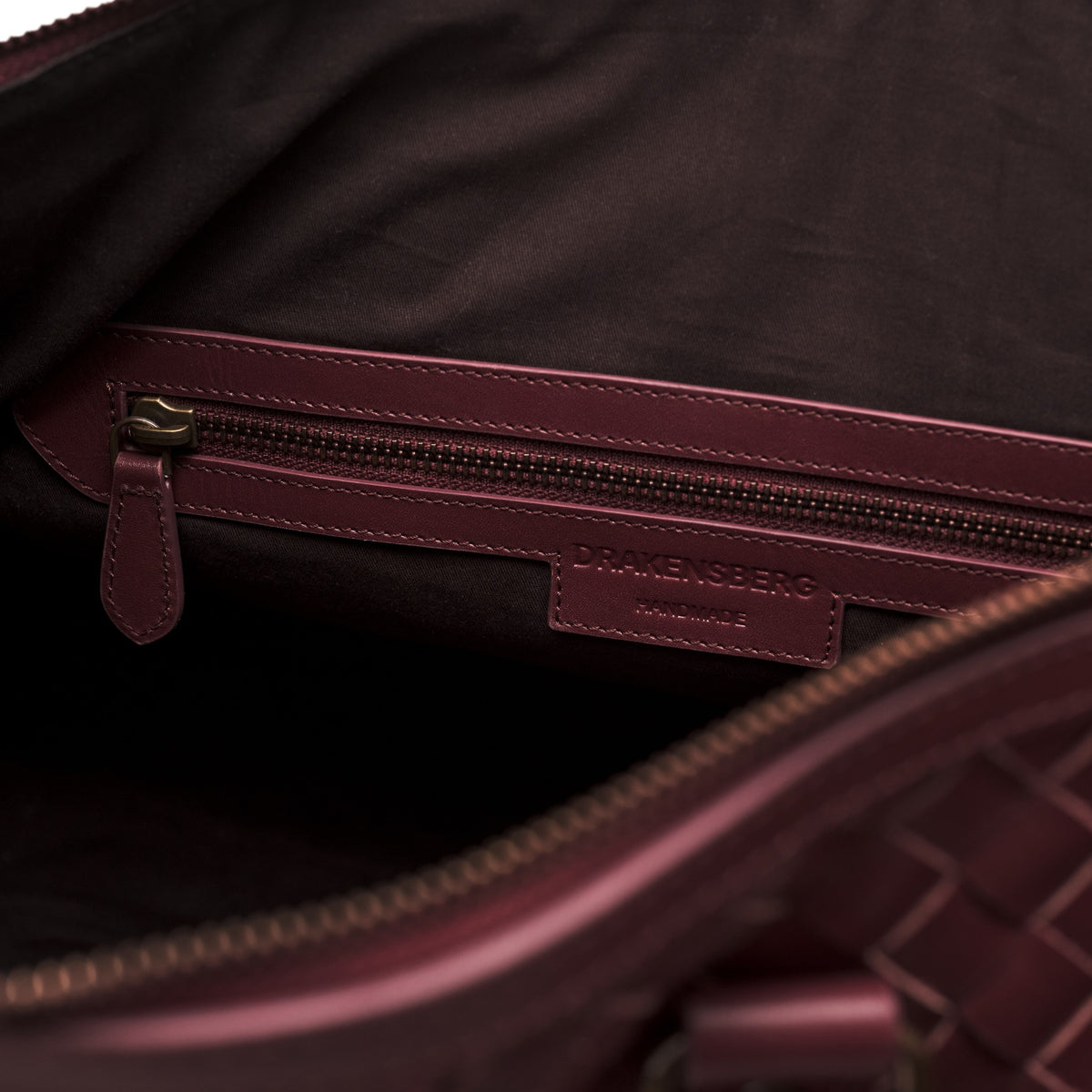 James (50) woven leather weekender in Burgundy Red with internal zipped pocket