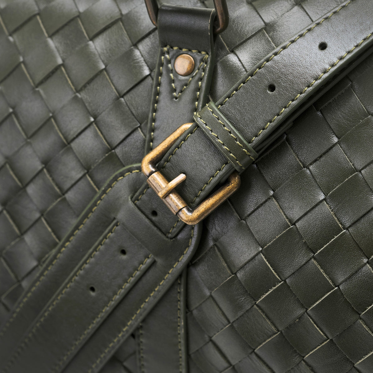 James (50) woven leather weekender in Moss Green with leather shoulder strap and woven texture in detail