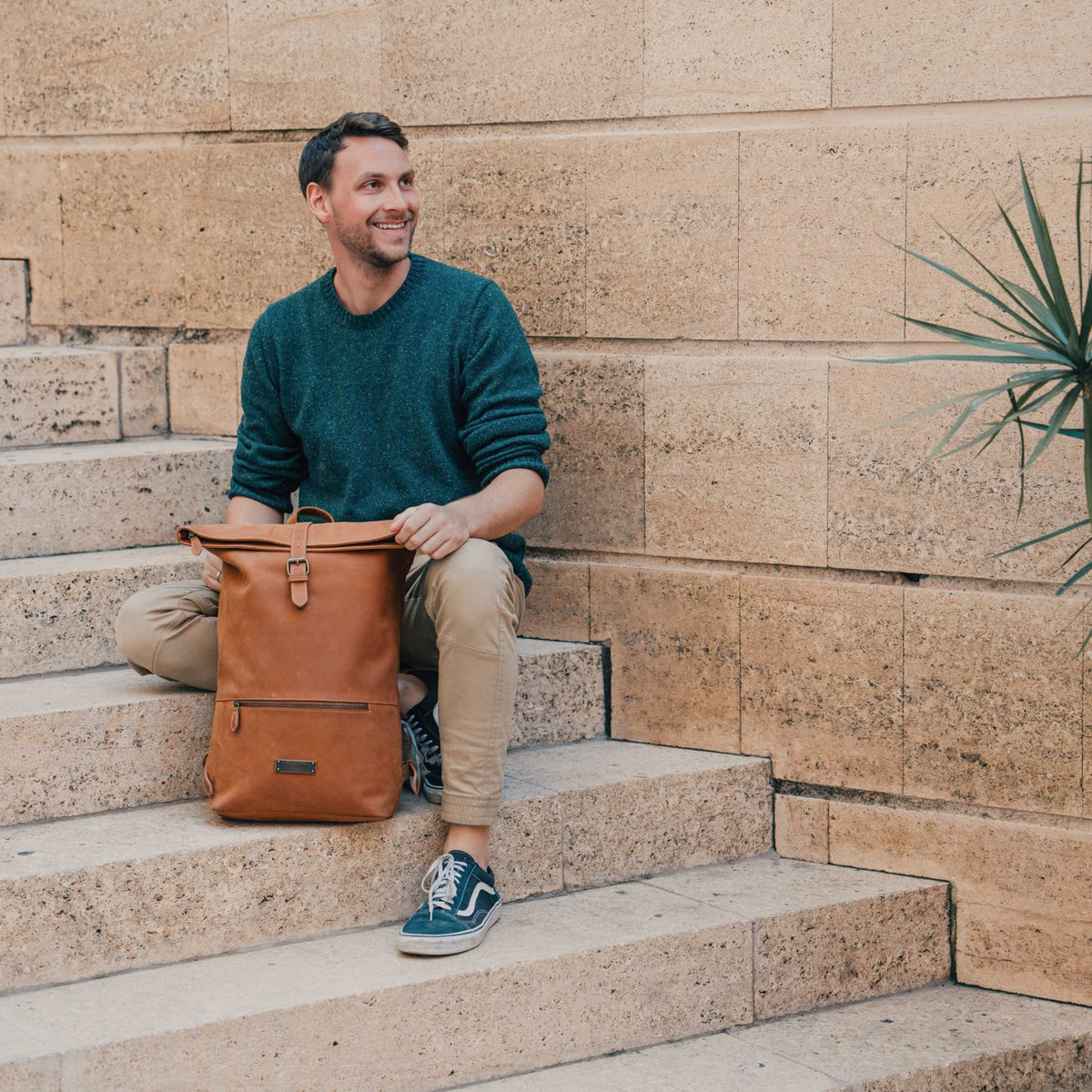 Ryan leather rolltop backpack in Cognac Brown – backpack in an everyday setting