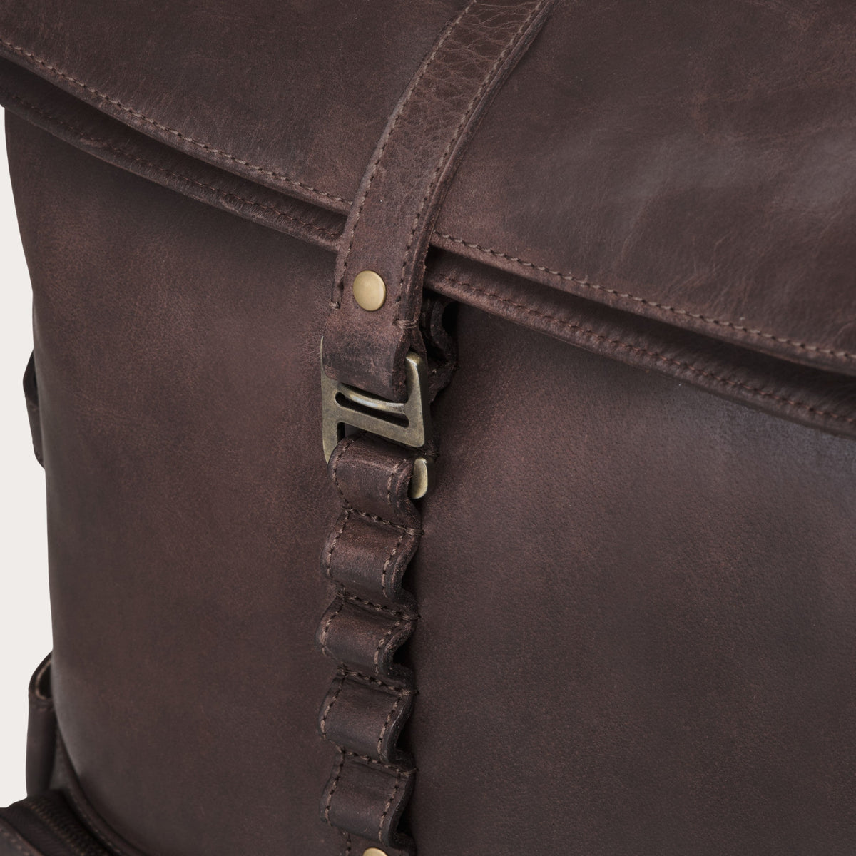 Arthur leather laptop backpack in Coffee Brown – leather strap and metal buckle on the rolltop
