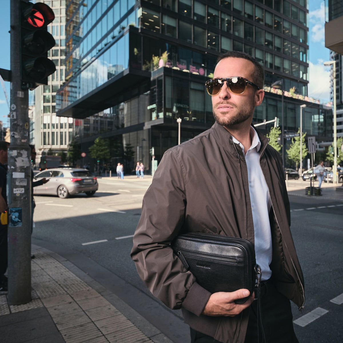 Roberto wristlet in Black worn as a crossbody bag