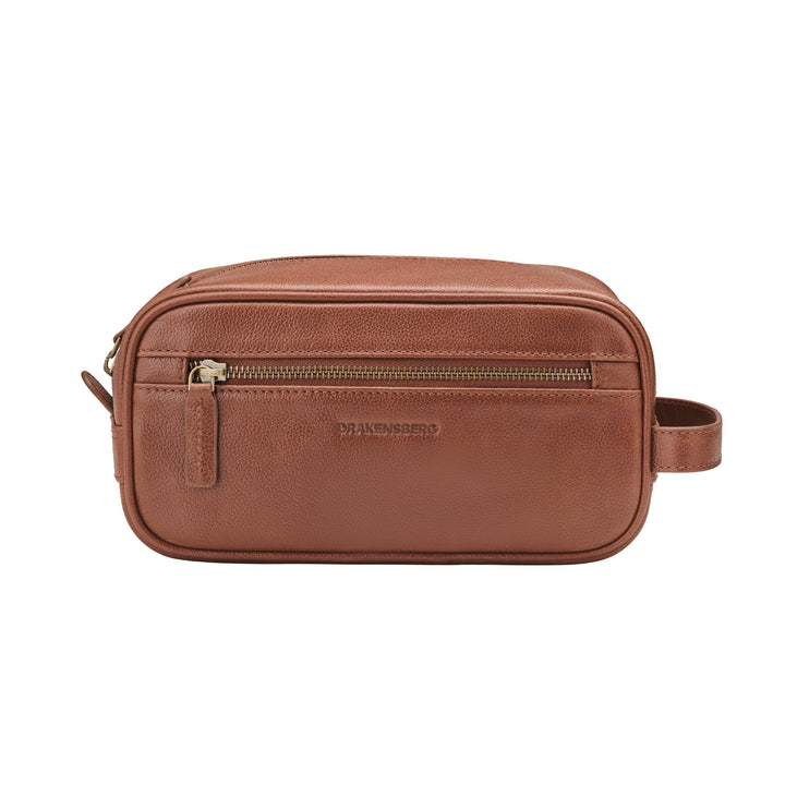 Vue de face de la trousse de toilette en cuir Dino en Marron châtaigne avec poche zippée