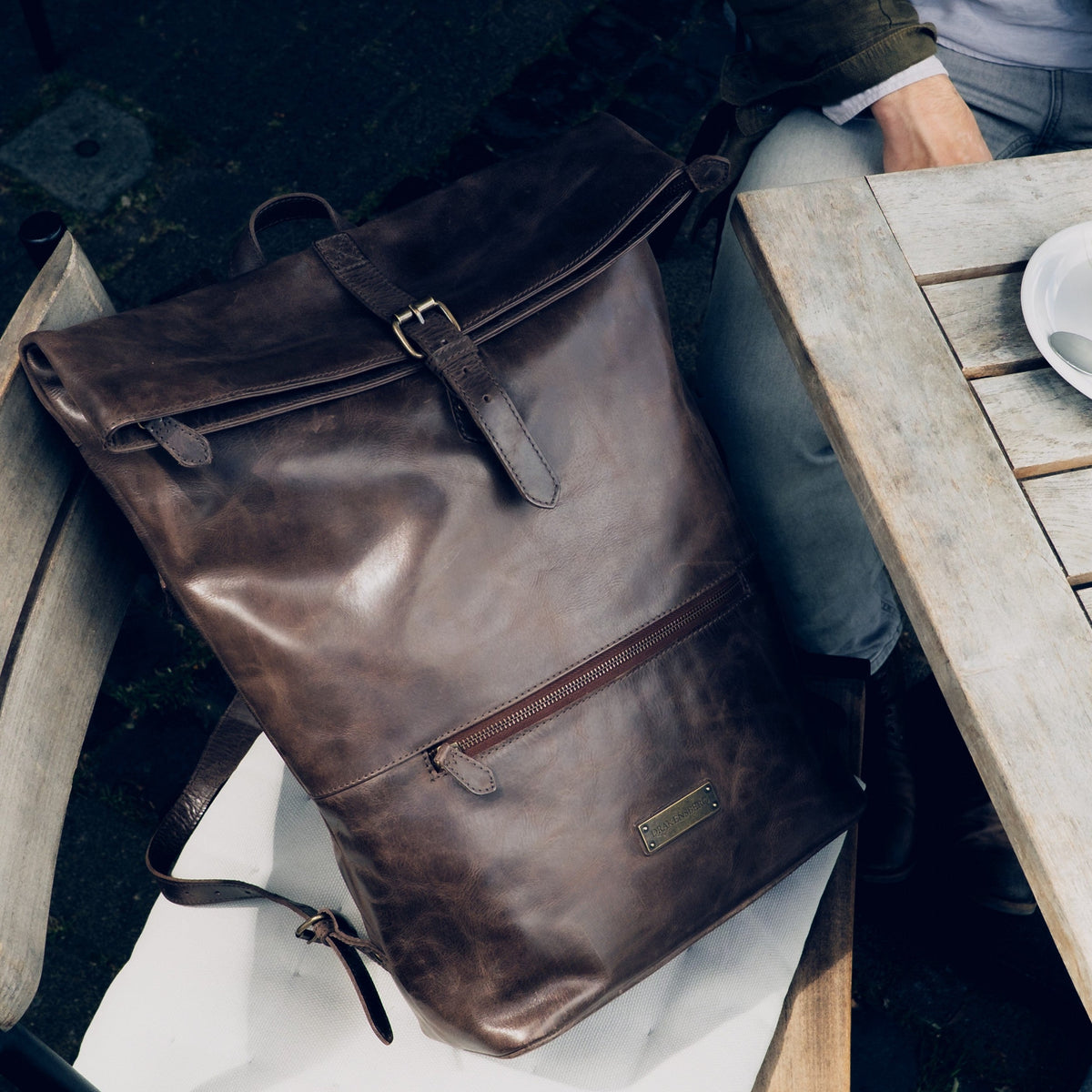 Ryan leather rolltop backpack in Coffee Brown – backpack in an everyday setting