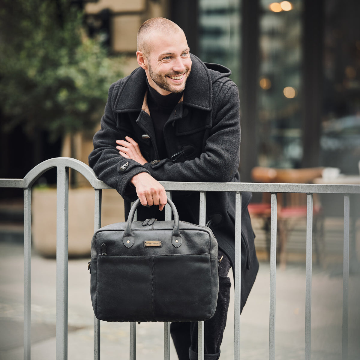 Hugo leather briefcase in Vintage Black – carried by its handles